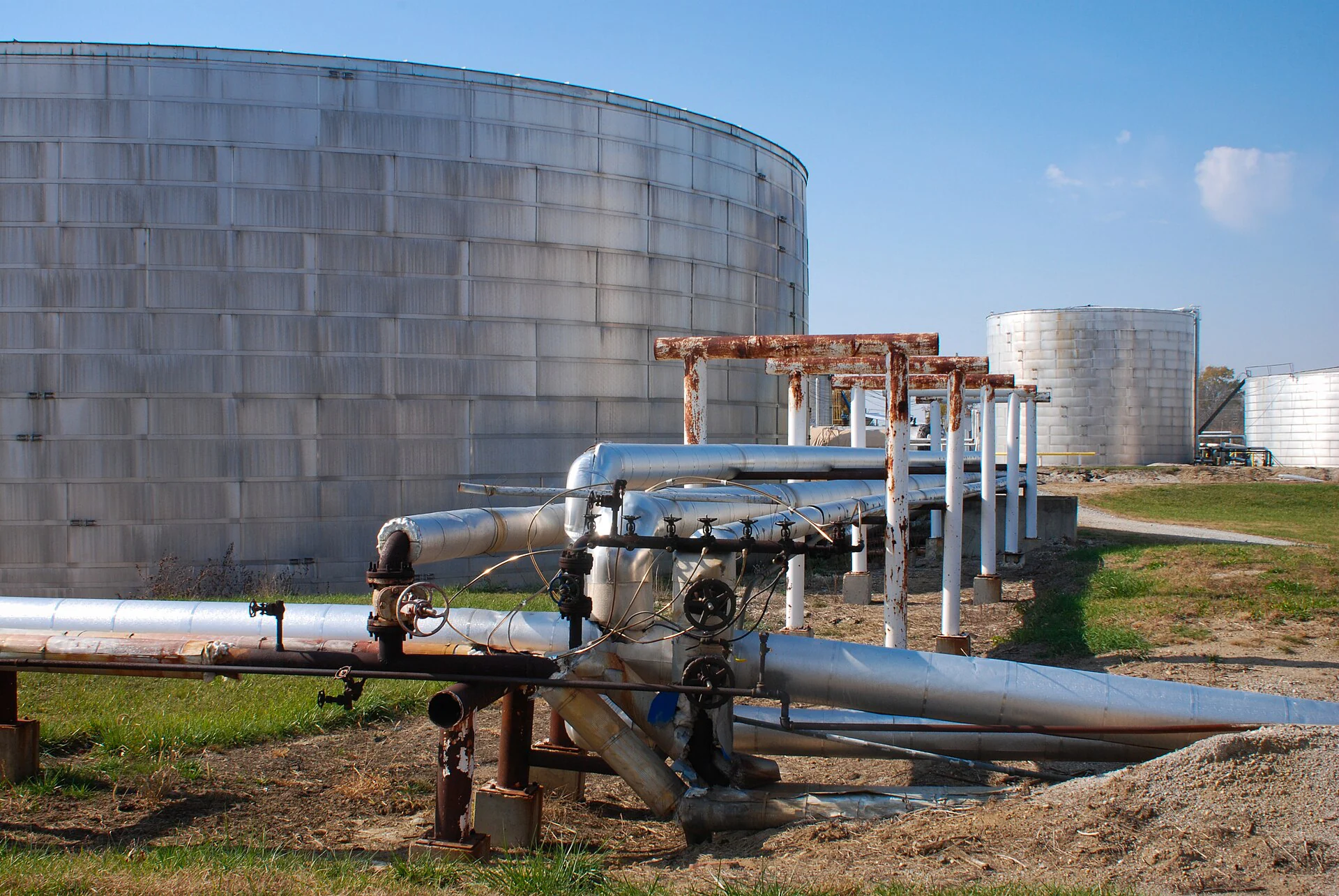 Insulated pipework connecting industrial storage tanks
